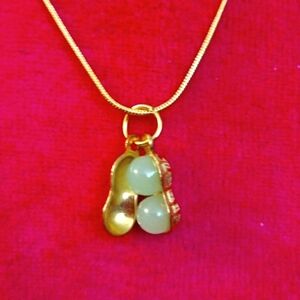 20",Gold plated necklace and pendant w/ faux jade peanuts.